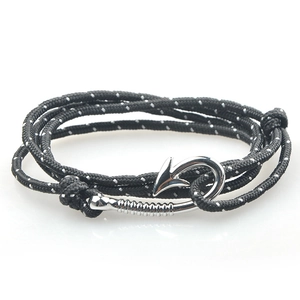 Detail of nautical multi-layer rope bracelet with silver anchor fish hook clasp