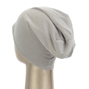 Detailed side view showing the soft knit texture and drape of this light grey beanie hat