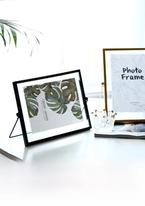 Detail of 5x7 geometric metal and glass photo frame with gold and black finish options