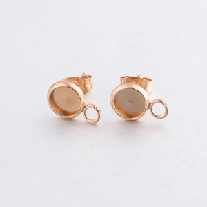 Macro shot of rose gold stainless steel earring base with hanging loop for DIY jewelry