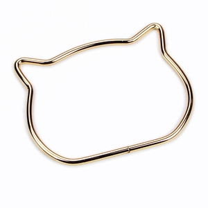 Polished gold cat-ear metal handle for handbags with a smooth glossy mirror finish