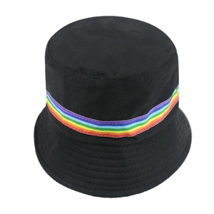 Detailed top view of a black canvas bucket hat featuring a vibrant rainbow striped band