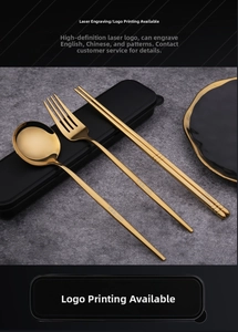 Close-up of golden stainless steel cutlery set with spoon fork and chopsticks in case