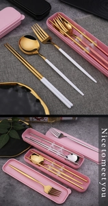 Detail of portable stainless steel cutlery set with pink storage case in macro view