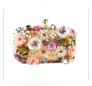 Front view of evening clutch bag with handmade colorful 3D beaded flowers and gold clasp