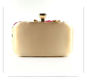 Rear view of gold satin evening clutch with elegant floral pearl bead embroidery