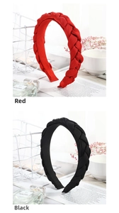 Detail of twisted braided headbands in red and black colors with a chic chiffon fabric texture