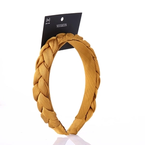 Mustard yellow braided wide headband with textured fabric and stable frame design
