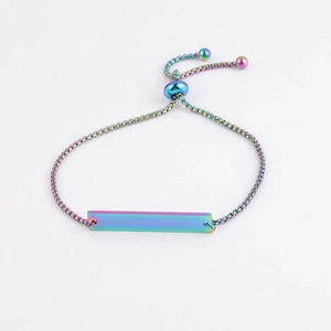 Macro detail of rainbow plated stainless steel bar bracelet with adjustable slide clasp