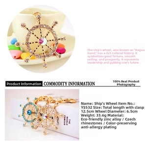 Detail view of crystal nautical ship wheel keychain with sparkling rhinestones and center gem