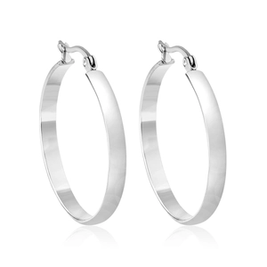 Polished silver stainless steel hoop earrings with secure clasp mechanism in macro detail