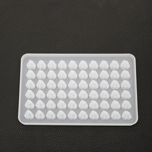 Detailed macro view of 60-cavity diamond-shaped silicone mold for DIY resin casting