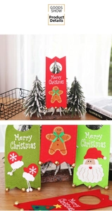 Close-up of Merry Christmas felt door hangers with Santa and bells for holiday decor