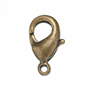 Close-up of high-quality bronze lobster clasps for DIY jewelry making with spring mechanism