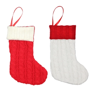 Set of red and white cable knit Christmas stockings with hanging loops for decor