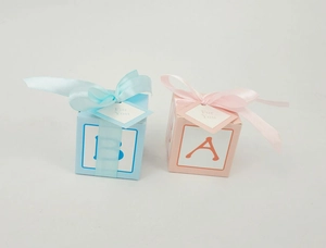 Blue and pink square DIY favor boxes with silk ribbons and For You gift tags
