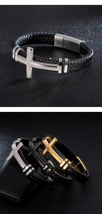 Detail view of woven leather bracelets with silver and gold metal cross magnetic clasps