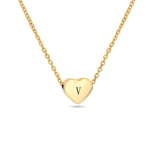 Close-up of golden heart pendant with engraved letter V on a fine link chain necklace