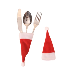 Mini red and white plush Christmas hat cutlery holders for holiday table decoration
