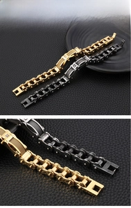 Detail of gold and silver motorcycle chain bracelets with mesh texture and single diamond