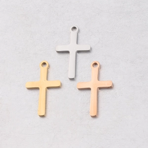 Polished stainless steel cross charms in silver, gold, and rose gold finishes