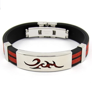 Detail of black silicone bracelet featuring silver metal plate with red flame engraving