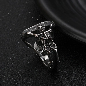 Gothic punk skull ring in vintage silver finish with detailed rib cage and spine band