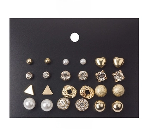 Set of 12 assorted geometric earrings with pearls and zircons on a black display card