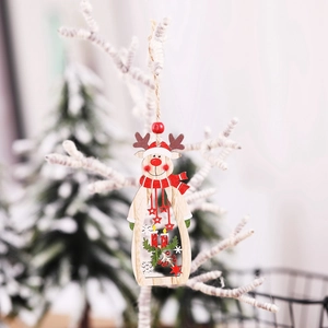 Wooden reindeer Christmas ornament with cutout star on snow-covered white branch