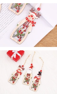 Detailed view of hollow carved wooden Christmas ornaments with reindeer and Santa motifs