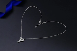 Detailed close-up of S925 sterling silver letter P pendant with micro-pave cubic zirconia