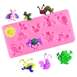 Pink silicone mold with butterfly and bee shapes for DIY fondant cake decoration