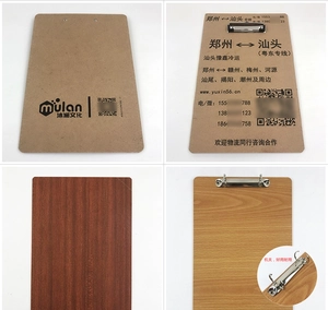 Macro detail of various A4 wooden clipboards with durable metal clamps for office use