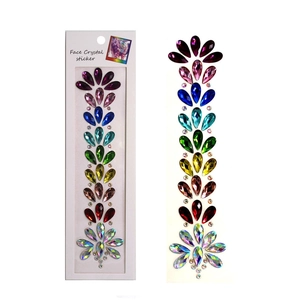 Close-up of colorful crystal face stickers with teardrop rhinestones in package