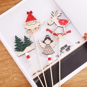 Handcrafted wooden Christmas picks with Santa, Reindeer and Tree on a rustic table