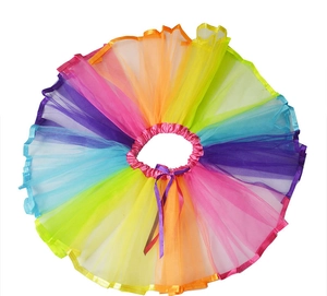 Detail of colorful rainbow tulle tutu skirt with elastic waist and purple ribbon bow