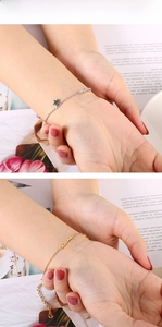 Detail of star charm and Lucky letter pendant on adjustable fashion chain bracelets