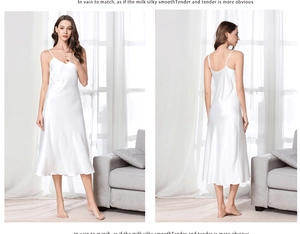 Detail of white satin long nightdress with thin straps and smooth silk finish