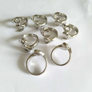 Top view of eight silver stainless steel wrench rings with mechanical biker design