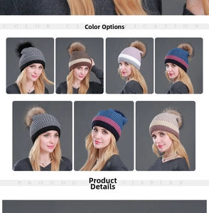 Detail view of multicolored winter knit beanies with large genuine raccoon fur pom-poms