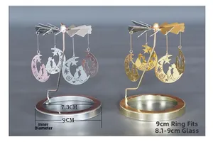 Detail der rotierenden Kerzenhalter-Aufsätze in Gold und Silber mit Mond- und Katzenmotiven