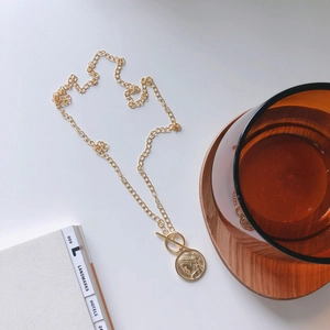 Detailed view of 925 sterling silver layered necklace with a vintage coin pendant