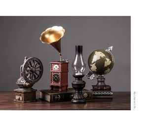 Detailed view of vintage resin ornaments featuring a retro gramophone and nautical globe