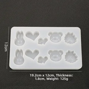 Detailed view of white silicone mold showing 19.2x12cm dimensions and animal shapes