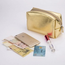 Top view of gold PU leather organizer showing storage capacity for phone and lipstick
