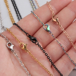 Five assorted stainless steel chain necklaces in gold, silver and rose gold finishes