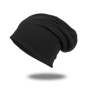 Classic black thin knit slouchy beanie for men and women showing soft texture and drape