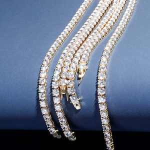 Detailed close-up of gold hip-hop lock pendant with sparkling zircon micro-pave setting