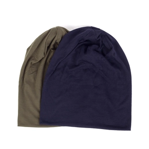 Flat lay of thin double-layered knit beanies in olive green and navy blue colors