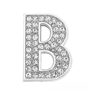 Detailed view of silver-toned letter B charm with sparkling rhinestones for DIY jewelry